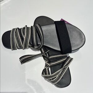 Rothy’s Stylish Black and Cream Tie Sandals